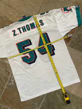 Load image into Gallery viewer, Vintage Miami Dolphins Zach Thomas Champion Football Jersey, Size 40, Medium